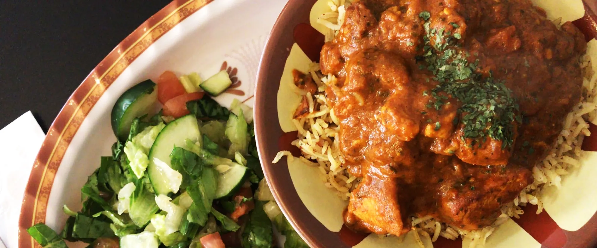 Chicken curry over basmati rice with fresh salad