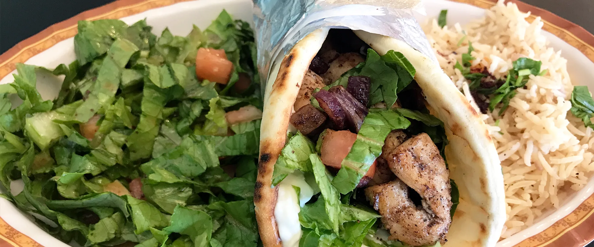 Chicken kabob pita wrap with fatoush salad and basmati rice